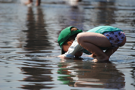child wearing green shirt drinking water thumbnail