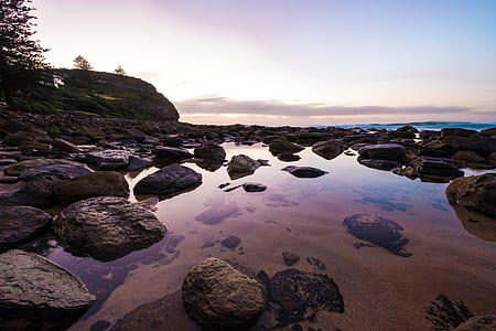 reflective photography of stones and sky thumbnail