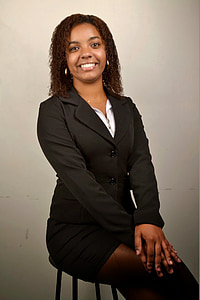 woman wearing blazer sitting on chair thumbnail