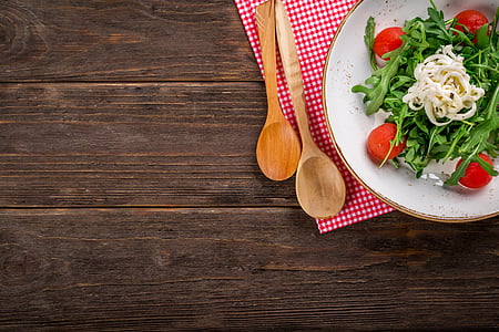 vegetables on white ceramic plate near two brown wooden ladles thumbnail