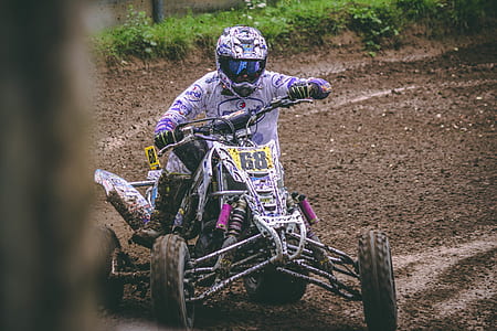 ATV racing on mud terrain thumbnail