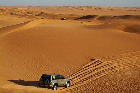 silver SUV on desert during daytime thumbnail
