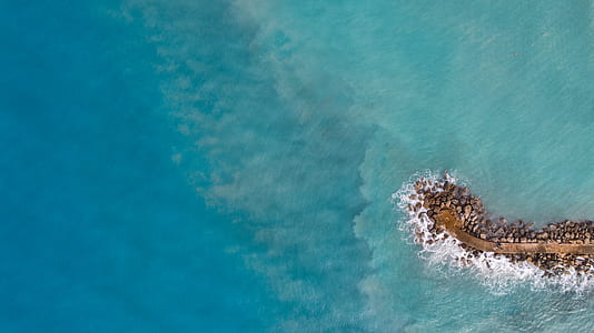 bird's eye view of dock near body of water thumbnail
