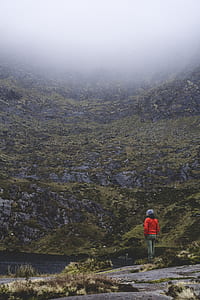 person standing near body of water outdoor thumbnail