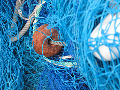 close up photo of blue fish net thumbnail