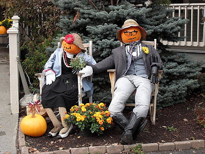 two person sitting on brown rocking chairs thumbnail