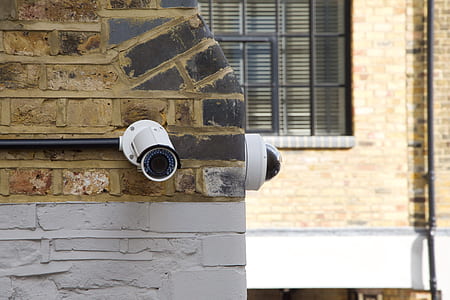 two white security cameras thumbnail