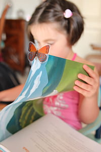 girl holding book thumbnail