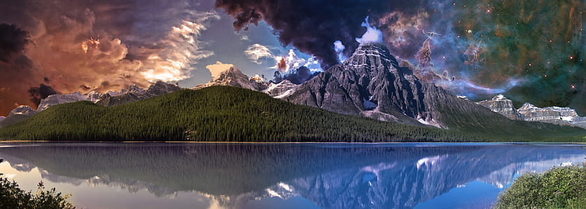 alps and green grass mountains in front of calm body of water thumbnail