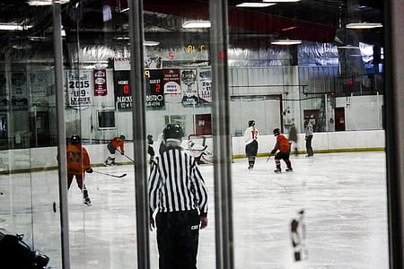 group of people playing ice hockey thumbnail