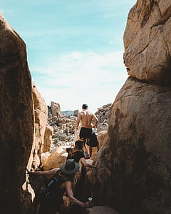 group of person exploring on cave thumbnail