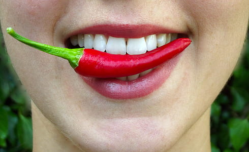 person biting red chili thumbnail