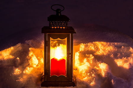 red candle inside brown wooden lantern thumbnail