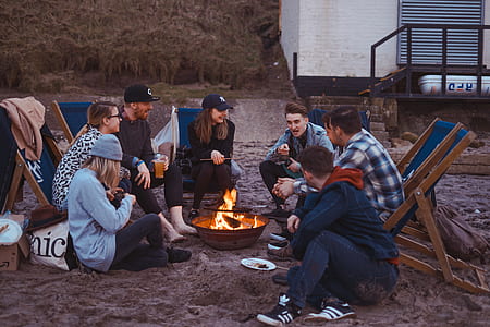 group of people surrounding fire pit thumbnail