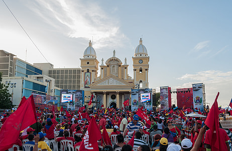 people gathering in front of cathedral thumbnail