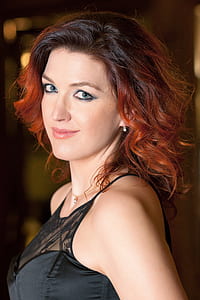 woman wearing black sleeveless dress thumbnail