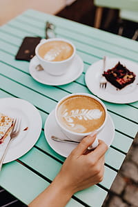 Drinking coffee and eating cake in a cafeteria thumbnail