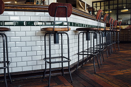 brown and black bar stool near bar countertop thumbnail