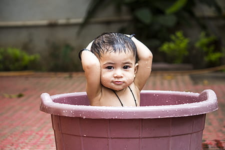 baby in plastic pail thumbnail