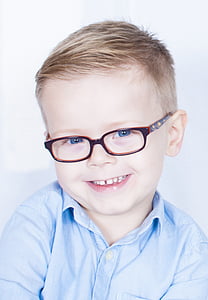 boy wearing eyeglasses with red frames thumbnail