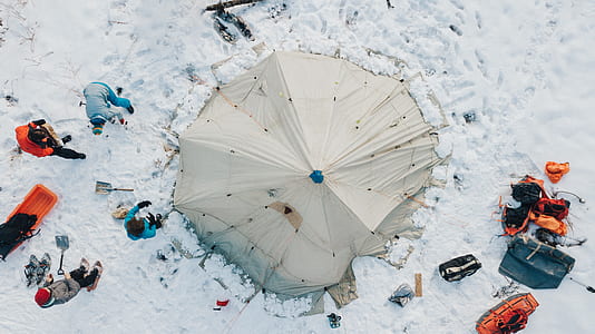 aerial photography of gray tent on field cover by snow thumbnail