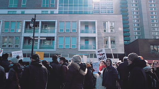 people standing front of building thumbnail