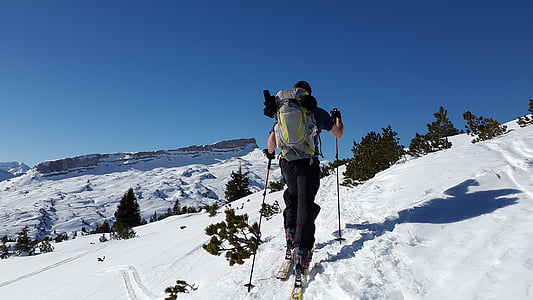 person climbing up the snowy hill thumbnail