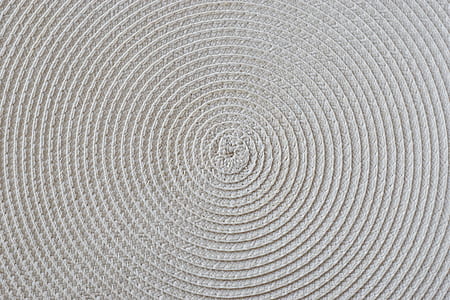 round beige woven mat in closeup photography thumbnail