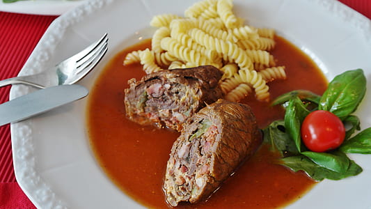 cooked pasta with sauce on white plate thumbnail