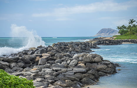 photo of rock formations near body of water thumbnail