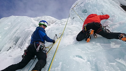 two person ice climbing during daytime thumbnail