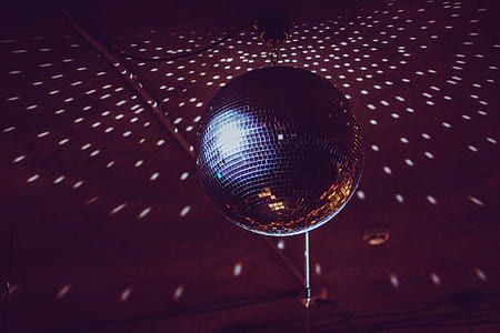 black and brown disco ball turned on inside room thumbnail