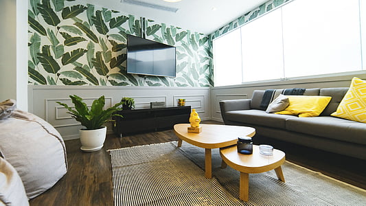 two brown wooden coffee tables near gray fabric sofa thumbnail