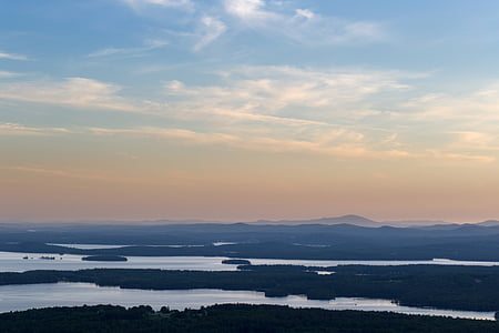 aerial view of mist mountain range under blue sky thumbnail