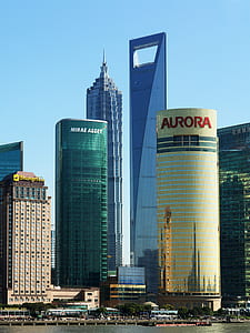 gold Aurora building near body of water thumbnail