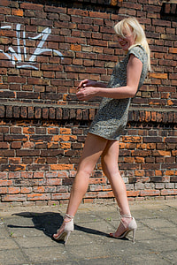 woman standing on gray concrete ground thumbnail