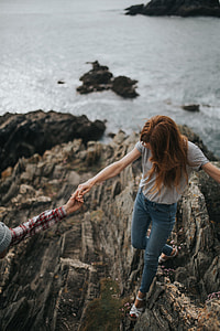 selective focus photography of man assisting woman thumbnail