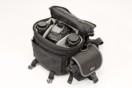black DSLR camera and two lenses inside bag thumbnail