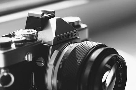 Gray Scale Photo of Olympus Dslr Camera thumbnail