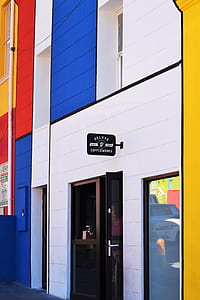white, yellow, and blue concrete building thumbnail