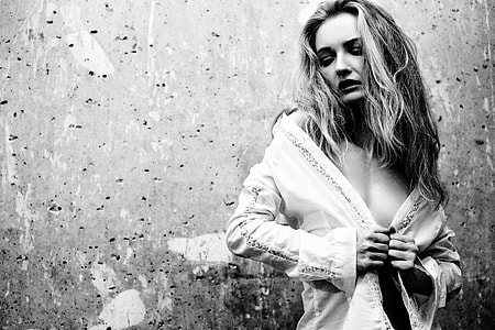 grayscale photo of woman with long-sleeved blouse thumbnail