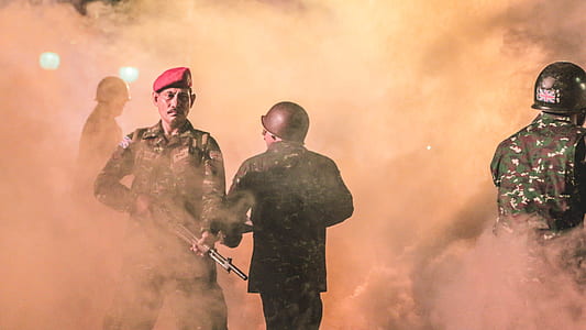soldier holding rifle surrounded by smoke thumbnail