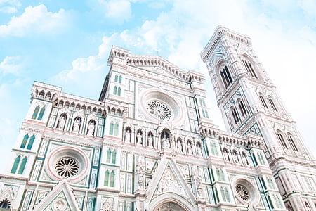 low-angle photography of white church over blue and cloudy sky thumbnail