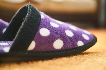 purple and white polka-dot indoor slipper on floor thumbnail