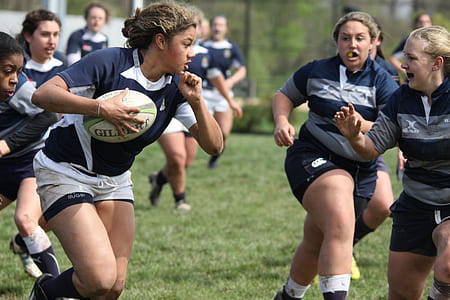 group of women playing rugby game thumbnail