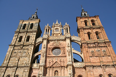 low-angle photography of brown cathedral at daytime thumbnail