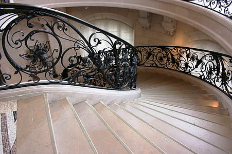 spiral white and black concrete staircase in room thumbnail