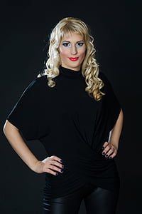 woman standing near black background thumbnail