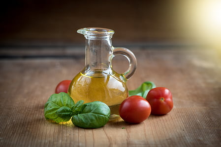 oil in vial near tomatoes thumbnail