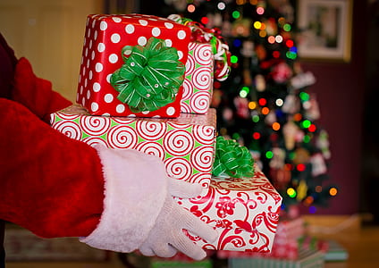 person carrying gift boxes thumbnail